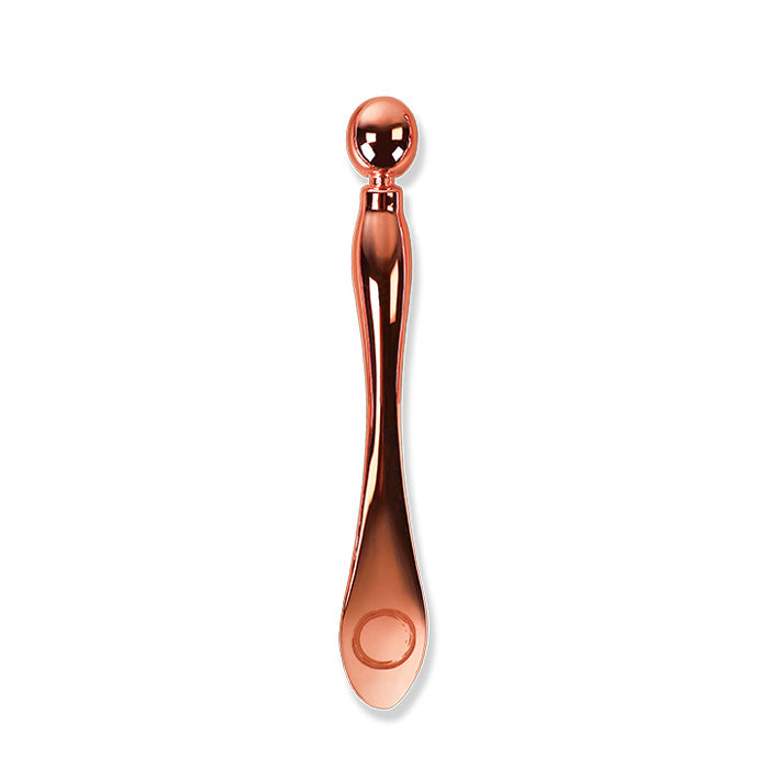 Mini multi skin tool by osmosis beauty displayed on white background
