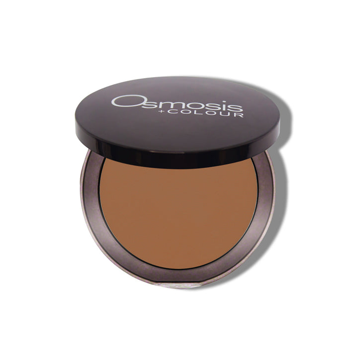 Pressed powder base earth tone Osmosis Beauty Makeup opened compact on white background