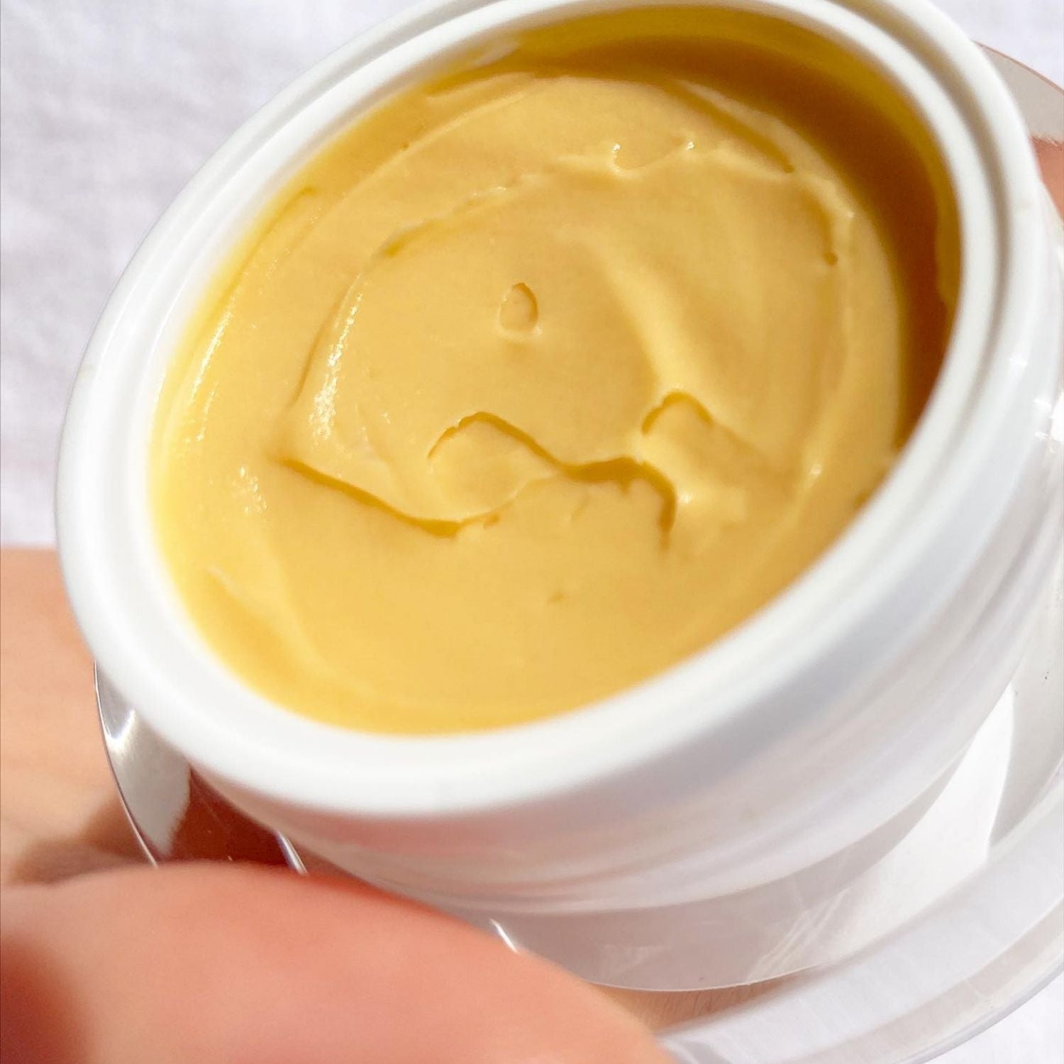 close up of tropical mango exfoliant in jar